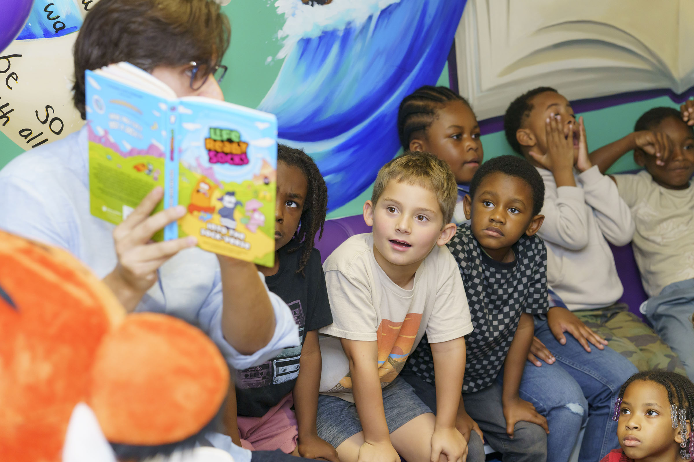 Kids listening to a read-aloud from a guest author